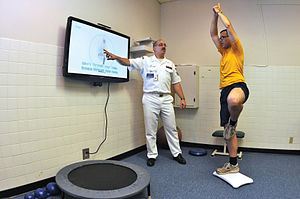 US Navy 090702-N-1783P-003 Hospital Corpsman 1st Class Guy Duke, left, and Electronics Technician 3rd Class Joshua Benedict demonstrate how the Physical therapy Department at Naval Health Clinic, Charleston use the Wii Fit&-195;&-173;s yo.jpg